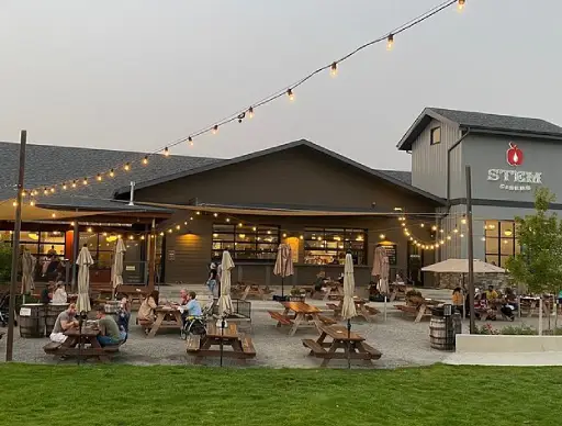 How to Spend a Perfect Day in Wenatchee Before Heading to The Gorge 4 Patio seating at a cider house with the Columbia River